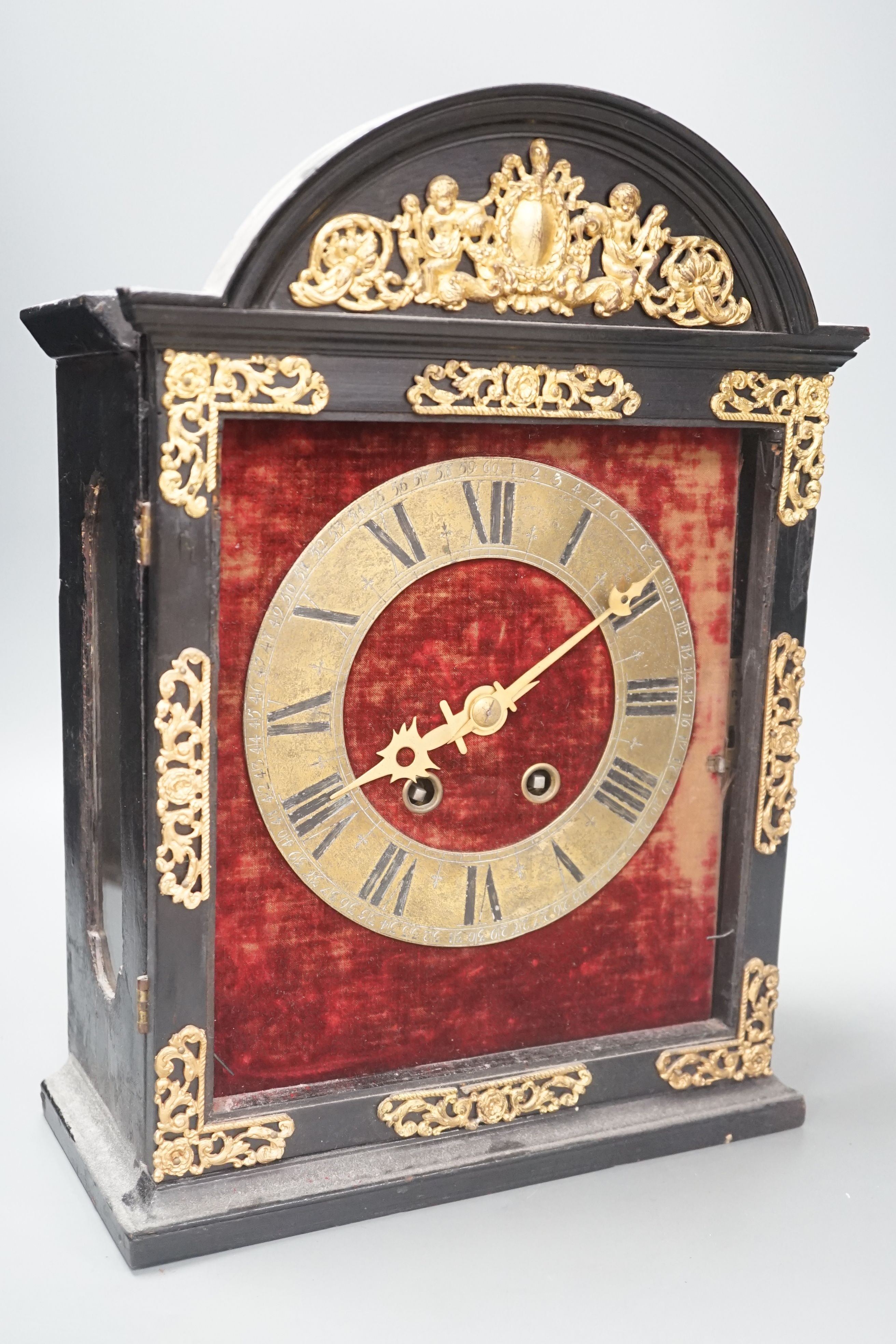 A 19th century replica of a 17th century Religieuse clock, 38cm